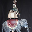 Servant on elephant, painted and decorated with pure gold - Helmut Perathoner